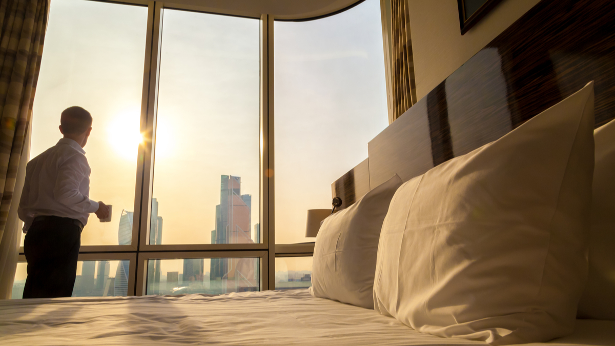 a-man-in-a-hotel-room-10-canada-coronavirus-travel-restrictions-and-regulations-you-need-to-know-about